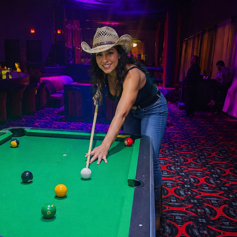 Guest playing pool at PT’s Lubbock
